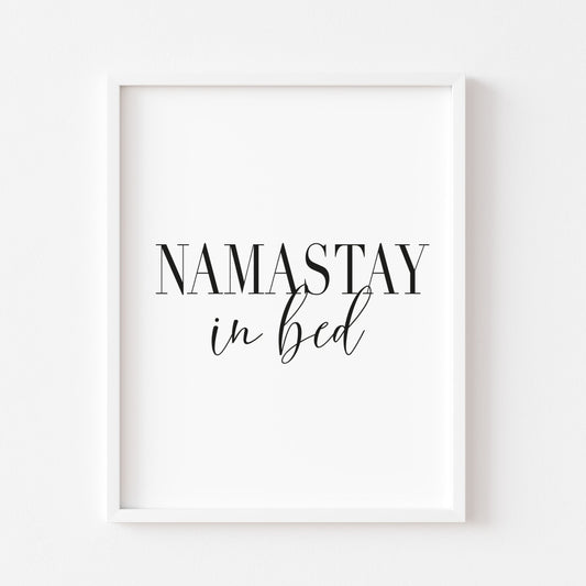 Namastay in bed black font portrait unframed print