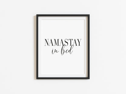 Namastay in bed black font portrait unframed print